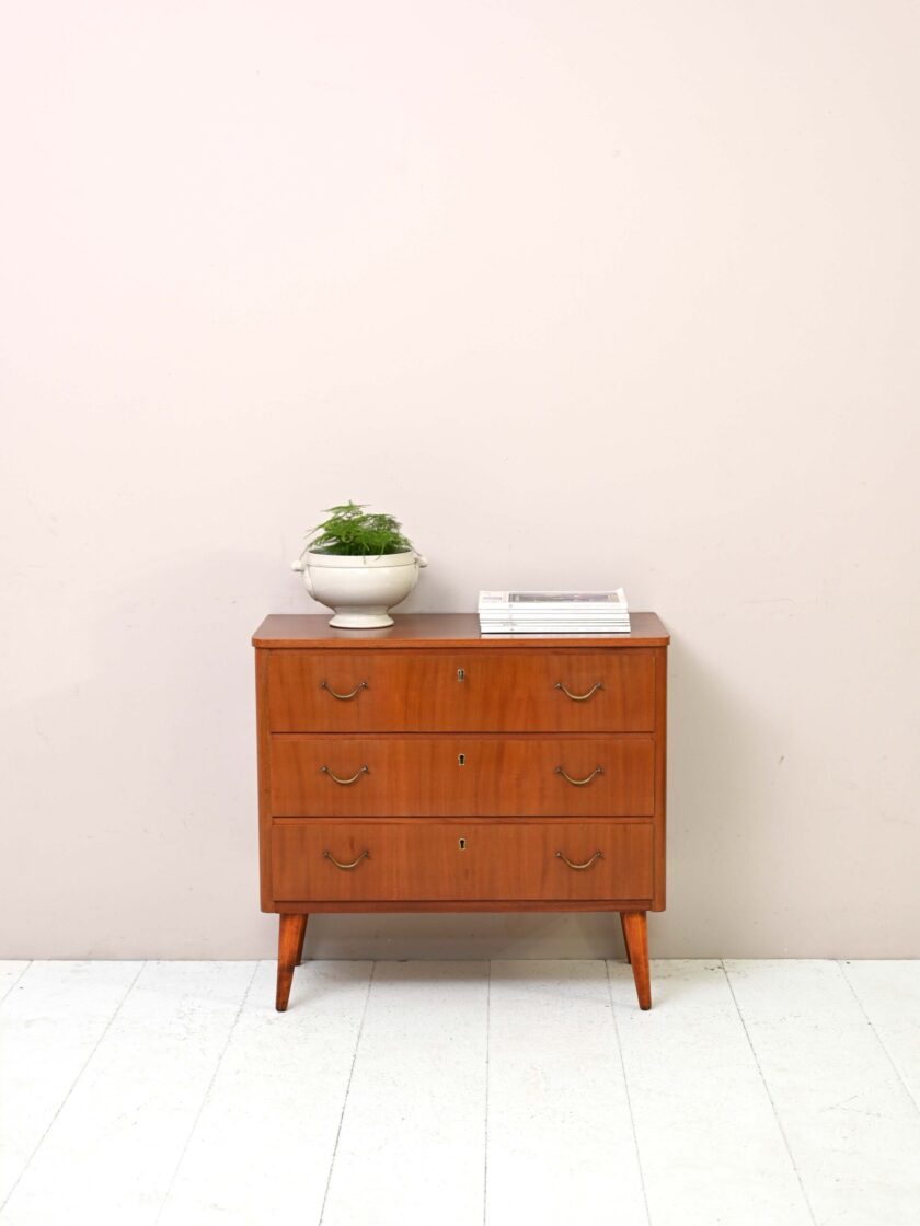 Vintage chest of drawers with golden handles